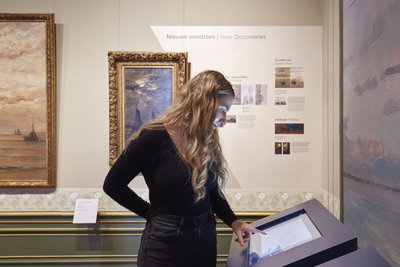 Woman looking at a screen in The Mesdag Collection