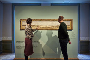 Visitors looking at a painting in The Mesdag Collection